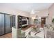 Virtually staged living room with modern furniture and built-in shelving at 2587 Countryside Blvd # 6303, Clearwater, FL 33761