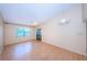 Bright living room featuring wood floors and sliding glass doors at 2587 Countryside Blvd # 6303, Clearwater, FL 33761