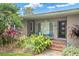 Mid-century modern home with brick steps and lush landscaping at 266 Snell Isle Ne Blvd, St Petersburg, FL 33704