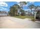 Spacious front yard with a large driveway and mature landscaping at 266 Snell Isle Ne Blvd, St Petersburg, FL 33704