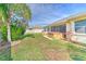 Backyard oasis with hot tub, playset, and lush landscaping at 3019 124Th E Ave, Parrish, FL 34219