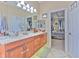 Large bathroom with double vanity, and access to bedroom at 3019 124Th E Ave, Parrish, FL 34219