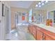Elegant bathroom with double vanity, garden tub, and separate shower at 3019 124Th E Ave, Parrish, FL 34219