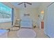 Bedroom with crib, rocker, and built-in shelving at 3019 124Th E Ave, Parrish, FL 34219