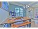 Bright dining area with a wooden table and large windows at 3019 124Th E Ave, Parrish, FL 34219