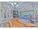 Farmhouse style dining room with wooden table and chandelier at 3019 124Th E Ave, Parrish, FL 34219