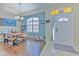 Light and airy entryway with tile flooring and access to dining room at 3019 124Th E Ave, Parrish, FL 34219