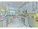 Open concept kitchen with white cabinets at 3019 124Th E Ave, Parrish, FL 34219