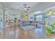 Open floor plan with kitchen island and hardwood floors throughout at 3019 124Th E Ave, Parrish, FL 34219