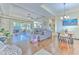 Bright living room with hardwood floors, views of pool and lanai at 3019 124Th E Ave, Parrish, FL 34219
