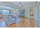 Spacious living room with hardwood floors, large TV, and access to backyard at 3019 124Th E Ave, Parrish, FL 34219