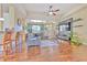 Spacious living room with hardwood floors and large TV at 3019 124Th E Ave, Parrish, FL 34219