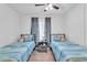 Guest bedroom with twin beds, perfect for or guests at 3141 Lake Pine Way # D2, Tarpon Springs, FL 34688