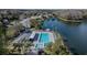 Inviting community pool and spa, overlooking a tranquil lake at 3141 Lake Pine Way # D2, Tarpon Springs, FL 34688