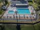 Relaxing community pool with plenty of lounge chairs and a spa at 3141 Lake Pine Way # D2, Tarpon Springs, FL 34688