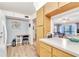 Kitchen with breakfast bar and view into living room at 3141 Lake Pine Way # D2, Tarpon Springs, FL 34688
