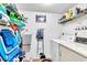 Convenient laundry room with washer, dryer and storage shelves at 3141 Lake Pine Way # D2, Tarpon Springs, FL 34688