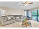 Living room with gray sectional sofa and coffee table at 3141 Lake Pine Way # D2, Tarpon Springs, FL 34688