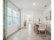 Spacious dining area with large window and view into entryway at 33174 Osprey Peak Way, San Antonio, FL 33576