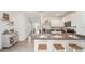 Open concept kitchen with island, stainless steel appliances, and view into dining area at 33174 Osprey Peak Way, San Antonio, FL 33576