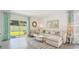 Light and airy living room with sectional sofa and access to the backyard at 33174 Osprey Peak Way, San Antonio, FL 33576