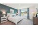 Bright main bedroom with a king-size bed and plenty of natural light at 33174 Osprey Peak Way, San Antonio, FL 33576