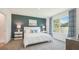Spacious main bedroom with a large bed and a navy accent wall at 33174 Osprey Peak Way, San Antonio, FL 33576