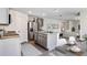 Modern kitchen with gray cabinets, granite counters, and an island at 33182 Osprey Peak Way, San Antonio, FL 33576