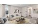 Living room with a neutral color scheme and flat-screen TV at 33182 Osprey Peak Way, San Antonio, FL 33576