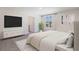 Spacious main bedroom with a large TV and ensuite bathroom at 33182 Osprey Peak Way, San Antonio, FL 33576