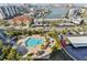 Aerial view of community pool and surrounding neighborhood at 400 Island Way # 1204, Clearwater, FL 33767