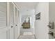 Apartment entry with mirrored wall and built-in storage at 400 Island Way # 1204, Clearwater, FL 33767