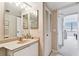 Bathroom with sink, medicine cabinet, and access to bedroom at 400 Island Way # 1204, Clearwater, FL 33767