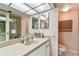 Bathroom with toilet, shower, and double vanity at 400 Island Way # 1204, Clearwater, FL 33767