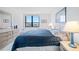 Bedroom with large window, dresser and bed at 400 Island Way # 1204, Clearwater, FL 33767