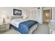 Well-lit bedroom with large closet and bathroom access at 400 Island Way # 1204, Clearwater, FL 33767
