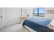 Bedroom with dresser, window and bed at 400 Island Way # 1204, Clearwater, FL 33767