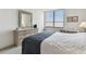 Bedroom with dresser, large window and bed at 400 Island Way # 1204, Clearwater, FL 33767