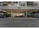 Condo building with covered entrance, parking, and a modern design at 400 Island Way # 1204, Clearwater Beach, FL 33767