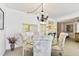 Bright dining area with chandelier and bay window view at 400 Island Way # 1204, Clearwater, FL 33767