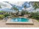 Octagonal hot tub surrounded by lush tropical landscaping at 400 Island Way # 1204, Clearwater, FL 33767