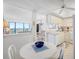 Bright kitchen with white cabinetry and a breakfast nook at 400 Island Way # 1204, Clearwater, FL 33767