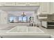 Kitchen sink with a view into living room at 400 Island Way # 1204, Clearwater, FL 33767