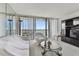 Living room features water view and updated glass coffee table at 400 Island Way # 1204, Clearwater, FL 33767