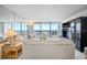 Bright living room with floor-to-ceiling windows and water views at 400 Island Way # 1204, Clearwater, FL 33767