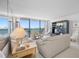 Spacious living room with water views and ample natural light at 400 Island Way # 1204, Clearwater, FL 33767