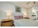Bedroom with dresser, bed, and window at 492 Santa Cruz Ne Pl # D, St Petersburg, FL 33703