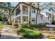 Condo building exterior with walkway and landscaping at 492 Santa Cruz Ne Pl # D, St Petersburg, FL 33703