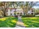 Updated condo building with manicured lawn and walkway at 492 Santa Cruz Ne Pl # D, St Petersburg, FL 33703
