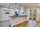 Modern kitchen with white cabinets and a breakfast bar at 492 Santa Cruz Ne Pl # D, St Petersburg, FL 33703